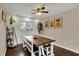 Dining room with wood table, modern decor, and plenty of natural light at 4260 Springwood Trl, Indianapolis, IN 46228