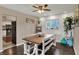 Bright dining area with shiplap wall, modern lighting, and wood table at 4260 Springwood Trl, Indianapolis, IN 46228