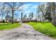 Charming two-story brick home featuring an inviting front yard and a long driveway at 4260 Springwood Trl, Indianapolis, IN 46228