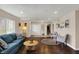 Inviting living room with hardwood floors, a blue sofa, and neutral paint at 4260 Springwood Trl, Indianapolis, IN 46228
