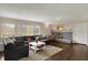 Inviting living room with hardwood floors, a fireplace, and a comfortable sofa at 4260 Springwood Trl, Indianapolis, IN 46228