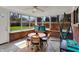 Sunroom with brick walls offering ample natural light at 4260 Springwood Trl, Indianapolis, IN 46228