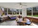 Inviting sunroom with brick accent walls and lots of natural light at 4260 Springwood Trl, Indianapolis, IN 46228
