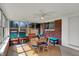 Bright sunroom with brick walls and lots of natural light at 4260 Springwood Trl, Indianapolis, IN 46228