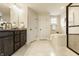 Bathroom with a soaker tub, standalone shower, modern vanity, and natural light at 4428 Voyageur Way, Carmel, IN 46074