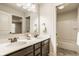 Bright bathroom features a double vanity with a large mirror and an adjacent shower-tub combo at 4428 Voyageur Way, Carmel, IN 46074
