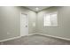 Cozy bedroom with neutral walls, carpet, white door and trim and a window providing natural light at 4428 Voyageur Way, Carmel, IN 46074