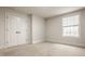 Comfortable bedroom features carpet, a window, and a closet with double doors at 4428 Voyageur Way, Carmel, IN 46074