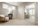 Spacious bedroom with a view into the Primary bedroom featuring neutral decor and ample space at 4428 Voyageur Way, Carmel, IN 46074