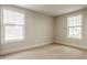 Bright bedroom with neutral walls, carpet flooring, and window with natural light at 4428 Voyageur Way, Carmel, IN 46074