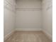 Walk-in closet features carpet floors, wire shelving, and ample storage space at 4428 Voyageur Way, Carmel, IN 46074