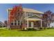 Beautiful two-story home with brick and siding exterior, covered patio, and landscaped yard at 4428 Voyageur Way, Carmel, IN 46074