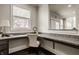A home office with granite countertops, built in desk, a window with blinds, and a chair at 4428 Voyageur Way, Carmel, IN 46074