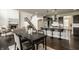 Modern kitchen with granite countertops, stainless steel appliances, and a breakfast bar at 4428 Voyageur Way, Carmel, IN 46074