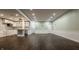 Open-concept living with wood floors, partial kitchen island, and crisp white trim creating an inviting space at 4428 Voyageur Way, Carmel, IN 46074