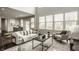 Spacious living room with a comfortable sofa, view of the kitchen, and dining area at 4428 Voyageur Way, Carmel, IN 46074