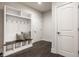 Bright mudroom with built-in storage, coat hooks, and bench seating at 4428 Voyageur Way, Carmel, IN 46074