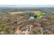 Aerial view of a home and land featuring a lake and forested areas at 4976 W Sims Ln, Monrovia, IN 46157