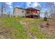 Image of the home's back exterior with a deck and an Indiana Hoosiers flag at 4976 W Sims Ln, Monrovia, IN 46157
