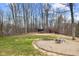 Spacious backyard featuring a fire pit and grassy area at 4976 W Sims Ln, Monrovia, IN 46157