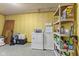 Unfinished basement space featuring washer, dryer, and shelving for storage at 4976 W Sims Ln, Monrovia, IN 46157