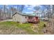 Charming home with a red porch, green roof, and natural surroundings at 4976 W Sims Ln, Monrovia, IN 46157