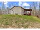Back exterior view of home with deck and lawn at 4976 W Sims Ln, Monrovia, IN 46157