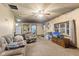 Cozy living room featuring carpet floors, neutral walls, and a refrigerator at 4976 W Sims Ln, Monrovia, IN 46157