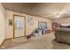 Cozy living room featuring carpet floors, a ceiling fan, and a view to the entry at 4976 W Sims Ln, Monrovia, IN 46157
