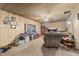 Cozy living room featuring carpet floors, a ceiling fan, and a view of the backyard at 4976 W Sims Ln, Monrovia, IN 46157