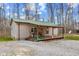 View of the home's rear elevation, showcasing the wooden deck and outdoor space at 4976 W Sims Ln, Monrovia, IN 46157