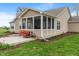Spacious backyard featuring a screened porch, wooden deck and green lawn at 52 E 286Th St, Atlanta, IN 46031