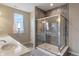 Modern bathroom featuring a glass enclosed shower with decorative tile surround and a double vanity with stone countertop at 52 E 286Th St, Atlanta, IN 46031