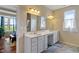 Bright bathroom with double vanity, sleek mirrors, and neutral decor, offering a clean and modern aesthetic at 52 E 286Th St, Atlanta, IN 46031
