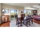 Dining area with view to the outdoor terrace and open to the living room with fireplace at 52 E 286Th St, Atlanta, IN 46031