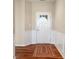 Inviting foyer with hardwood floors, wainscoting, and a classic white front door with glass accents at 52 E 286Th St, Atlanta, IN 46031