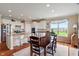 Bright eat-in kitchen featuring stainless steel appliances, granite countertops, and a cozy dining area with natural light at 52 E 286Th St, Atlanta, IN 46031