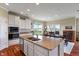 Spacious kitchen with granite countertops, modern appliances, and a view to the outside dining area at 52 E 286Th St, Atlanta, IN 46031