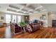 Cozy living room with a coffered ceiling, hardwood floors, and a stone fireplace at 52 E 286Th St, Atlanta, IN 46031