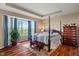 Tranquil bedroom with natural light, four-poster bed, and charming dresser, creating a relaxing retreat at 52 E 286Th St, Atlanta, IN 46031