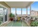 Relaxing screened porch with comfortable seating and a view of the open backyard at 52 E 286Th St, Atlanta, IN 46031