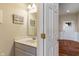 Well-lit half bathroom featuring a modern vanity, decorative mirror, and fresh neutral color palette at 52 E 286Th St, Atlanta, IN 46031