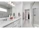 Bright bathroom with double vanity, quartz countertops, and a glass-enclosed shower at 5218 Pinehurst Ct, Whitestown, IN 46075