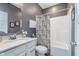 Modern bathroom features a stylish vanity with marble countertop and a shower with a decorative curtain at 5218 Pinehurst Ct, Whitestown, IN 46075