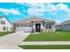 Charming single-story home with a well-manicured lawn and attached two car garage at 5218 Pinehurst Ct, Whitestown, IN 46075