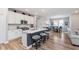 Bright kitchen with white cabinets, stainless appliances, and a spacious center island at 5218 Pinehurst Ct, Whitestown, IN 46075