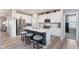 Well-equipped kitchen with stainless steel appliances, center island, and open layout at 5218 Pinehurst Ct, Whitestown, IN 46075