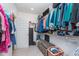 Walk-in closet providing ample storage with built-in shelving and hanging rods at 5218 Pinehurst Ct, Whitestown, IN 46075