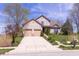 Two-story home featuring an attached two car garage and a concrete driveway at 5251 Ladywood Bluff Pl, Indianapolis, IN 46226