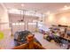 Spacious garage with epoxy floors, built-in shelving, and multiple garage doors for convenient access and ample storage at 5251 Ladywood Bluff Pl, Indianapolis, IN 46226